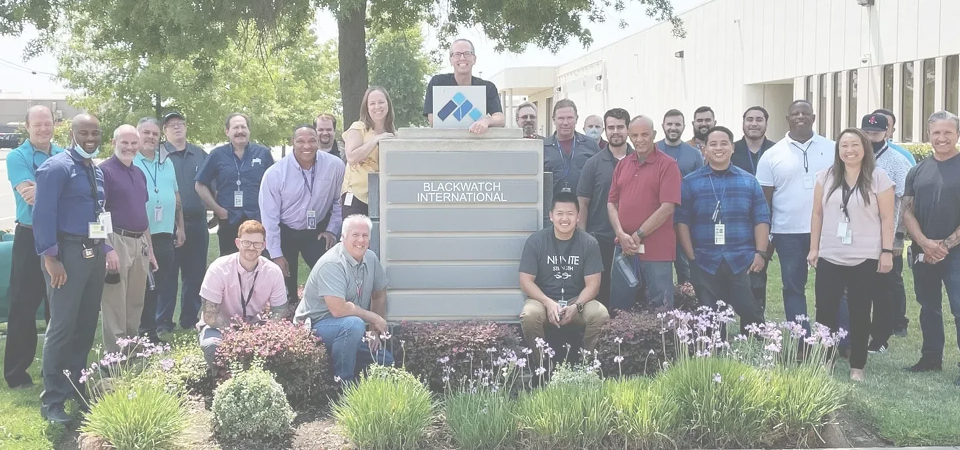 Blackwatch International team gathered at company headquarters